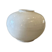 Low wide ceramic vase with a broad mouth and light glaze