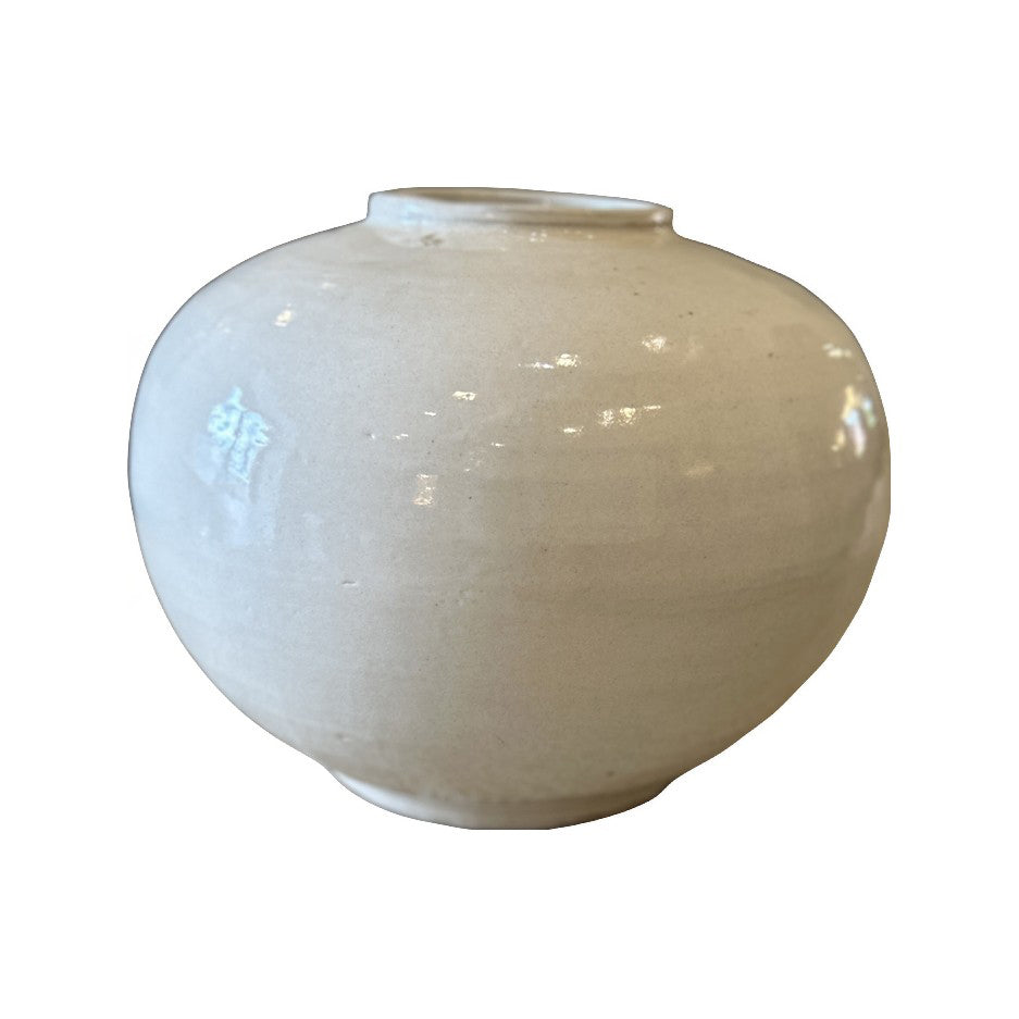 Low wide ceramic vase with a broad mouth and light glaze