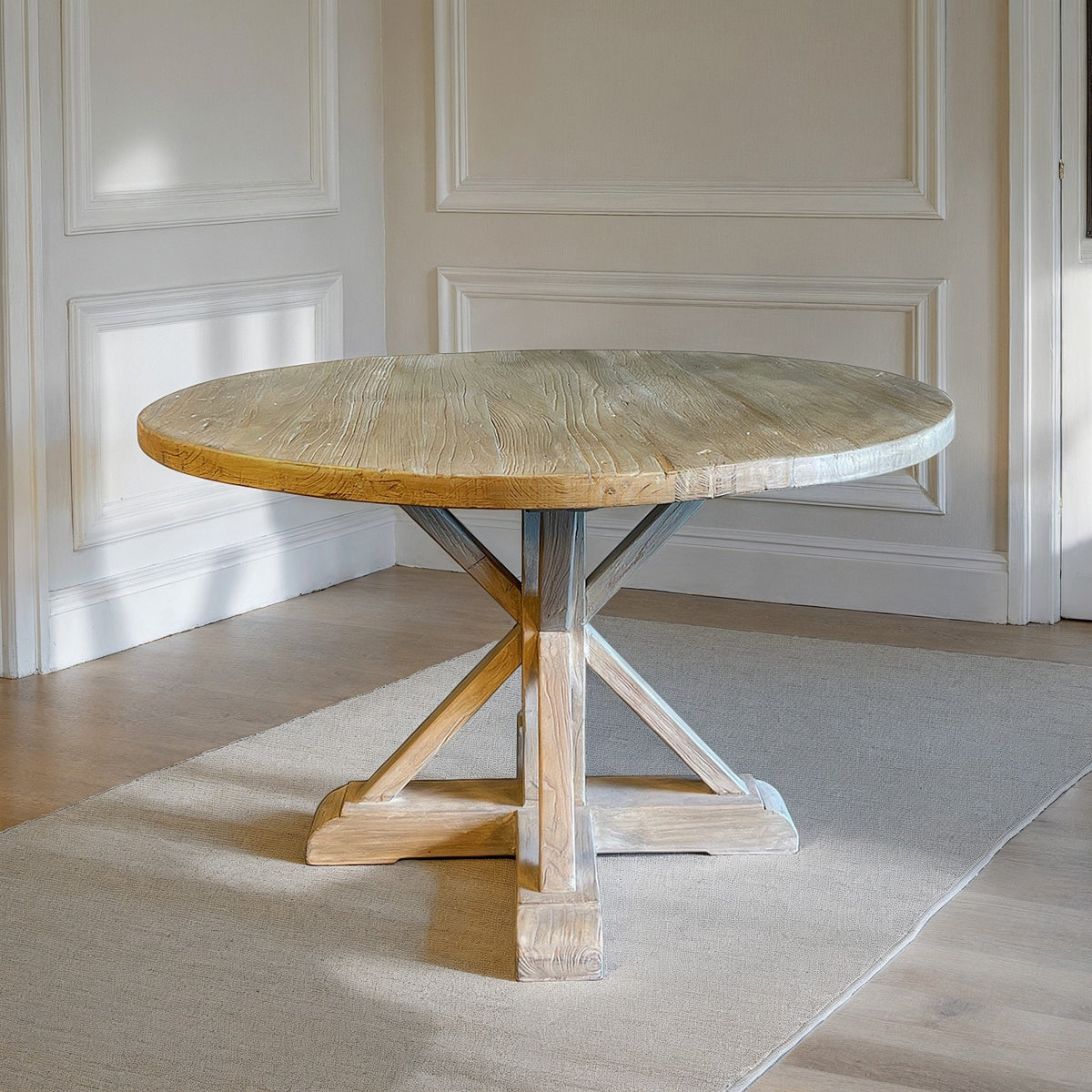 Small round bleached reclaimed elm dining table on an intersecting base