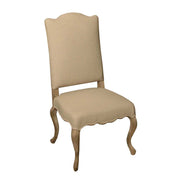 Dining chair with a tailored slipcover over a curved birch frame
