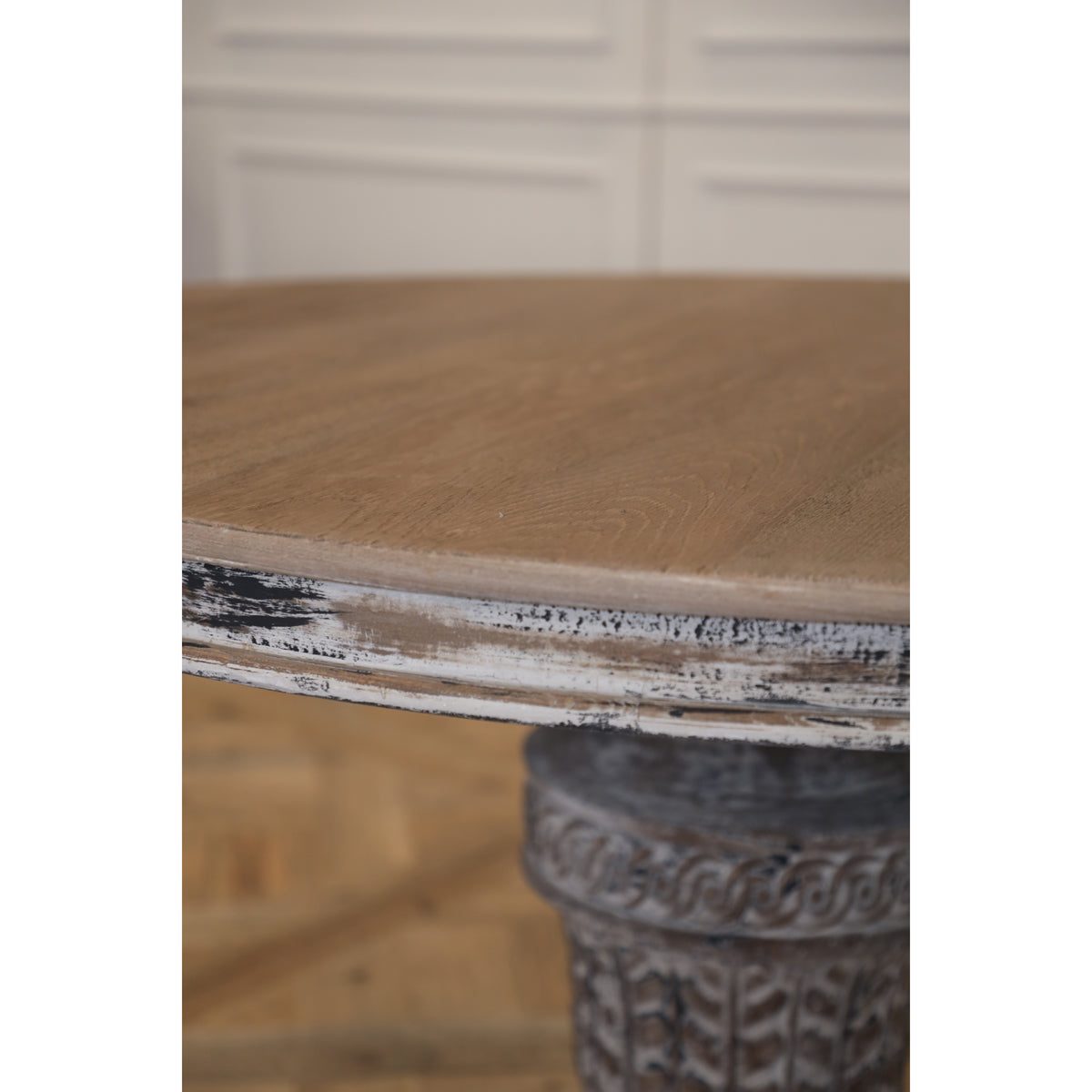 Reclaimed elm dining table on a carved pedestal base