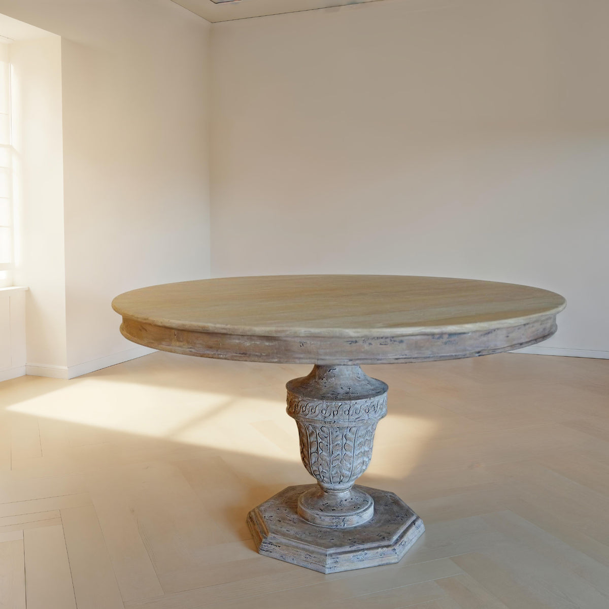 Reclaimed elm dining table on a carved pedestal base