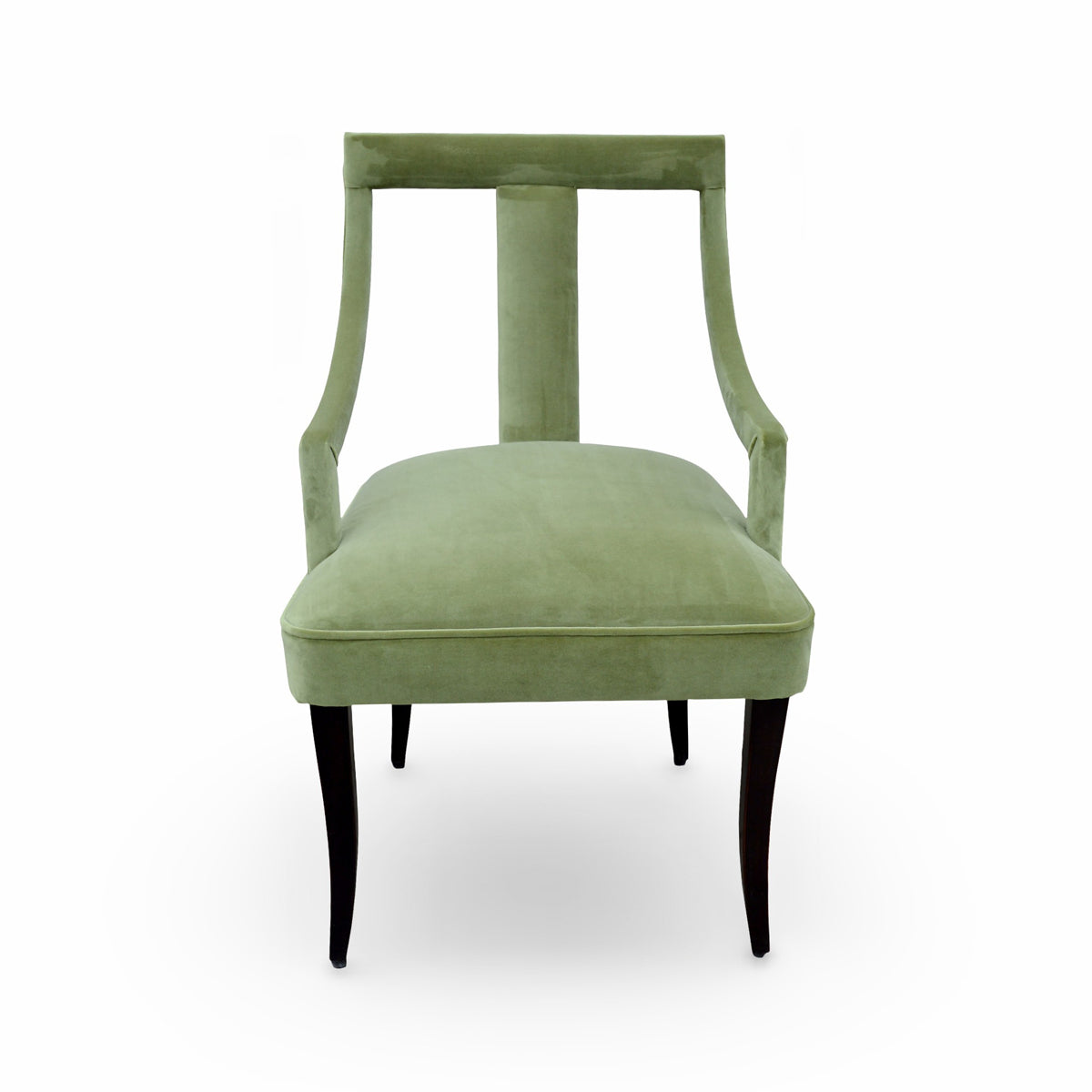 Arm chair upholstered in green velvet with curved arms on a birch frame