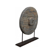Reclaimed wooden wheel mounted on a metal stand