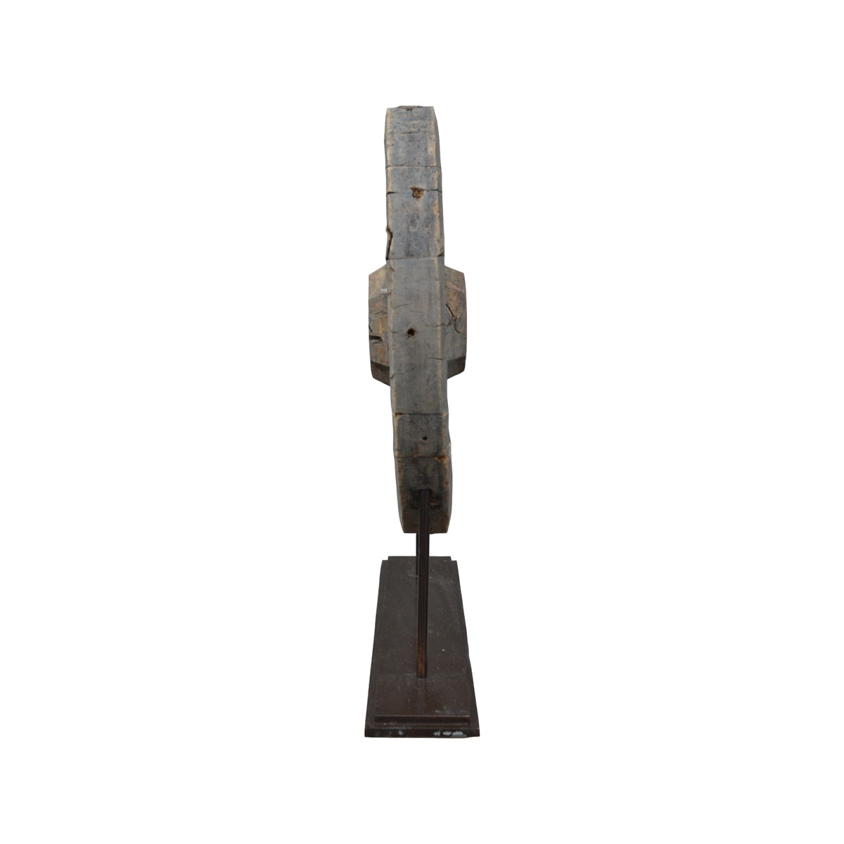 Reclaimed wooden wheel mounted on a metal stand