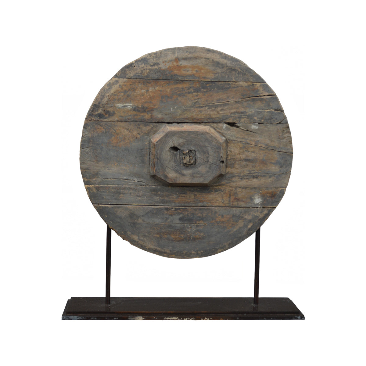 Reclaimed wooden wheel mounted on a metal stand