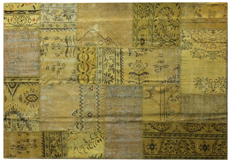 Vintage Turkish patchwork rug in softened yellow wool tones.