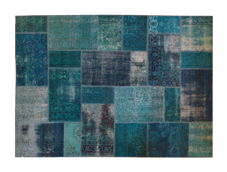 Vintage Turkish patchwork rug in turquoise wool tones.