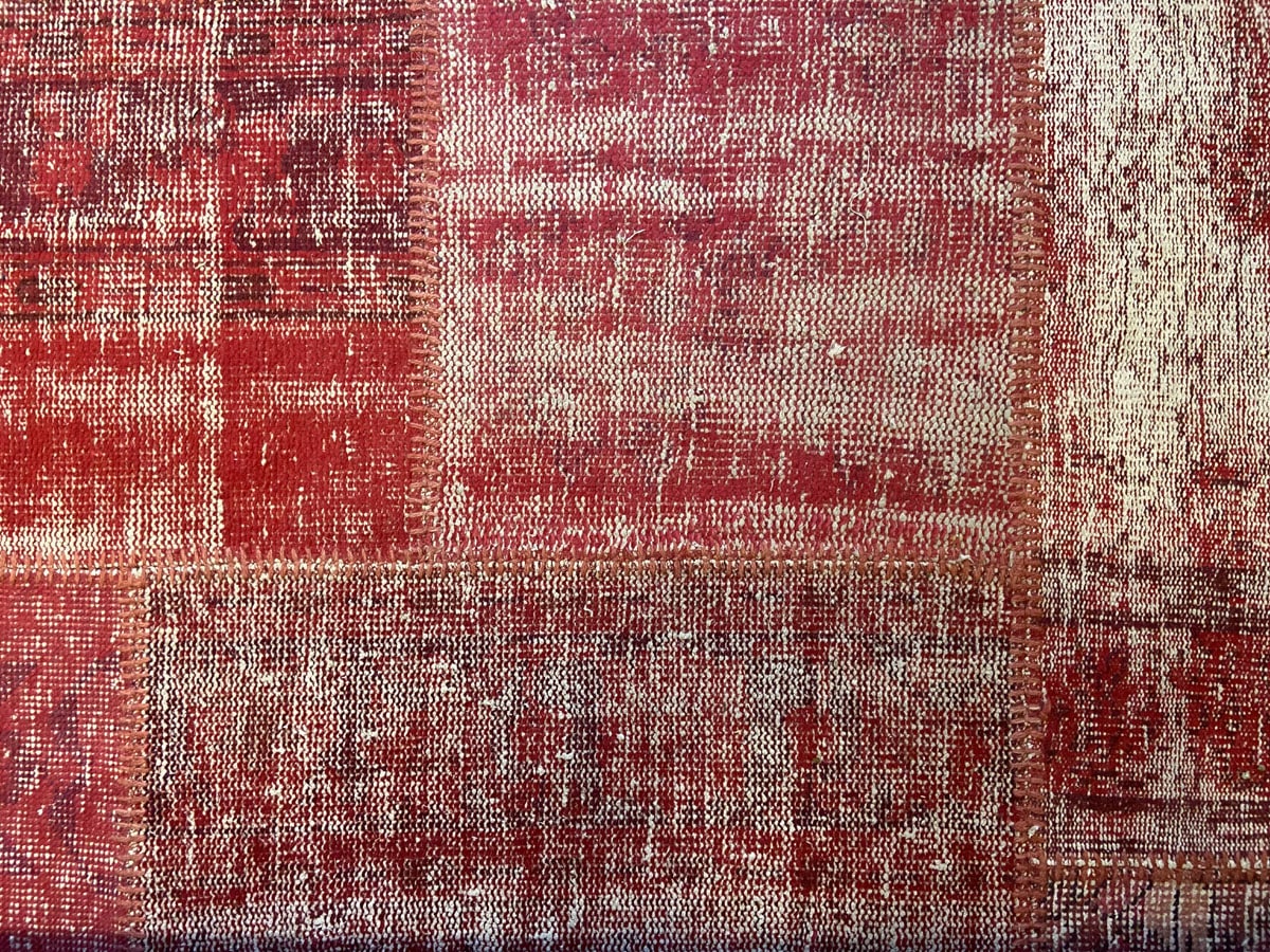 Large vintage Turkish patchwork rug in soft rose wool tones.