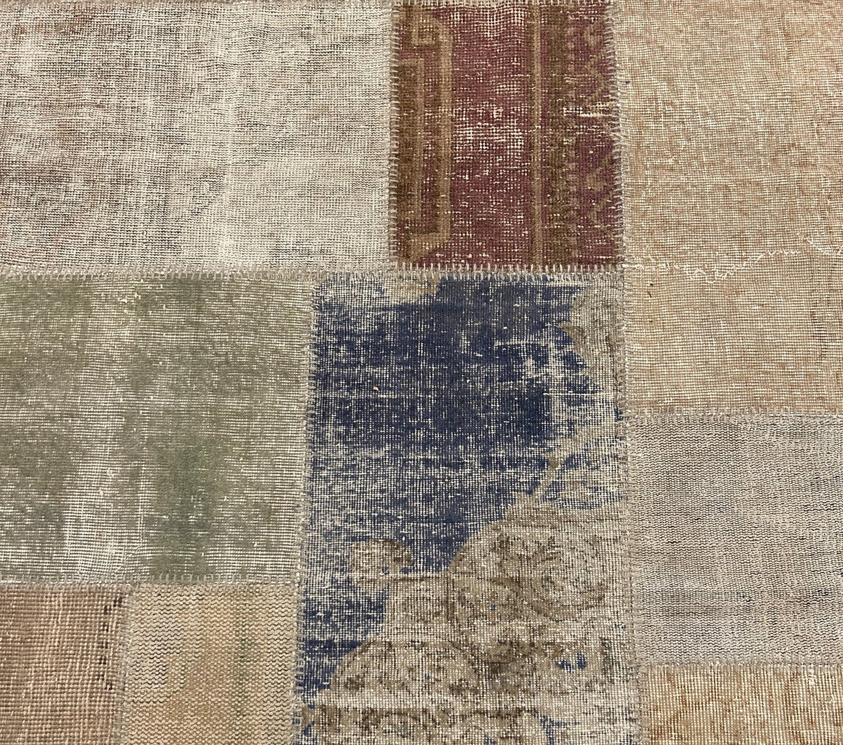 Vintage Turkish patchwork rug in a balanced rectilinear layout.