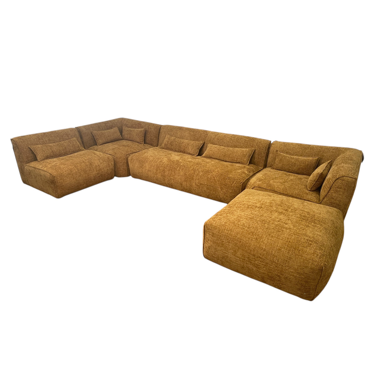 Modular one-seater in mustard fabric with curved corners and a low profile