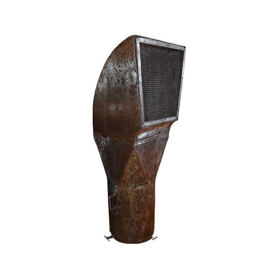 Tall weathered iron air vent with an enclosed upper grille