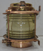Salvaged brass marine signal light with blue glass lens
