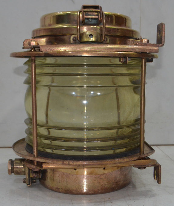 Salvaged brass marine signal light with blue glass lens