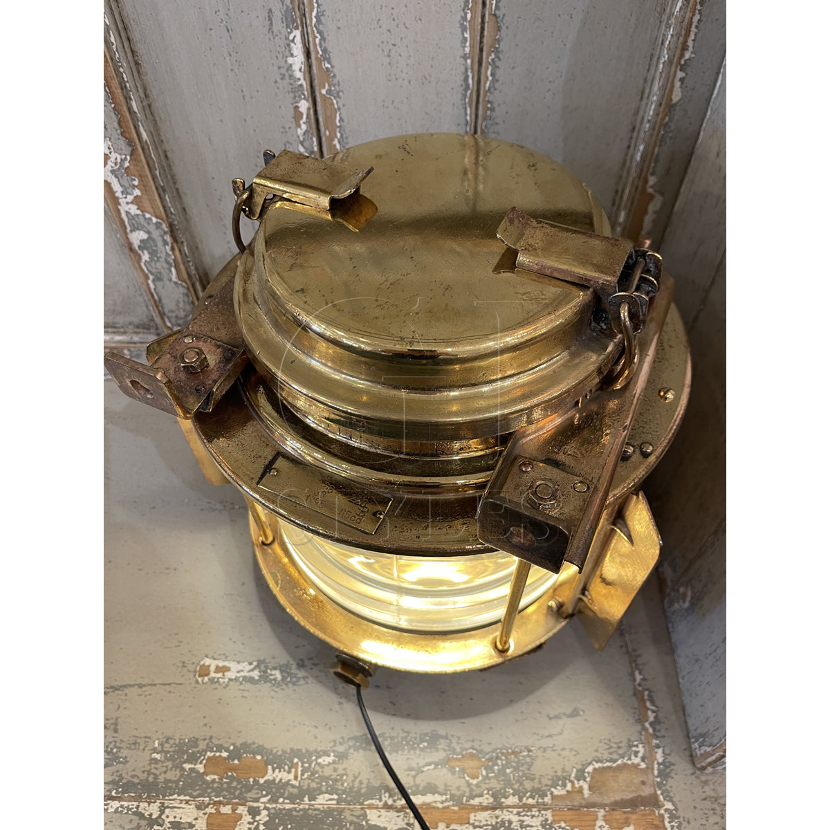 Salvaged brass marine bulls eye light with thick lens