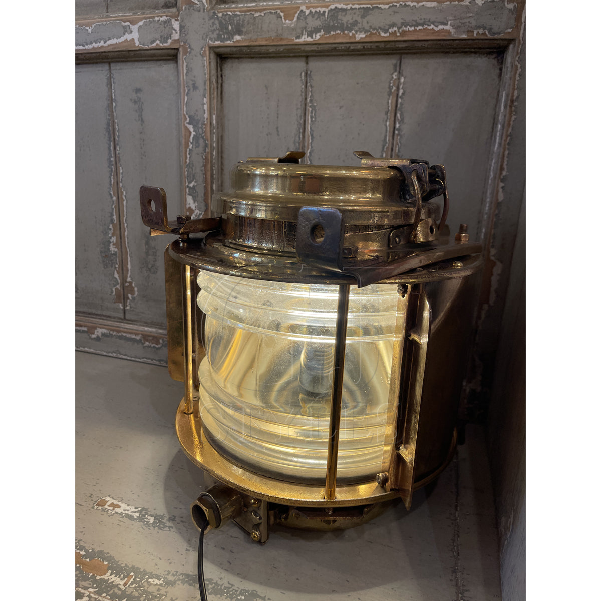 Salvaged brass marine bulls eye light with thick lens