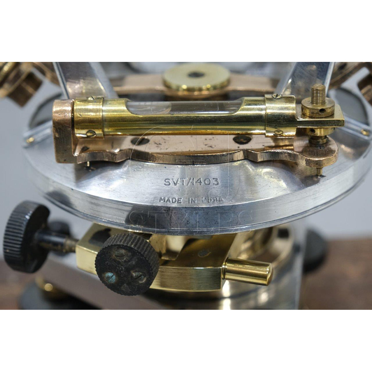 Salvaged aluminum and brass maritime instrument with patina