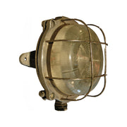 Salvaged round aluminum marine bulkhead light with iron cage