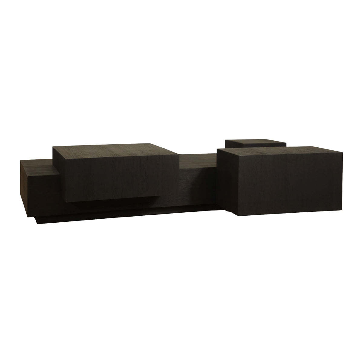 Low black oak coffee table with stacked, layered volumes