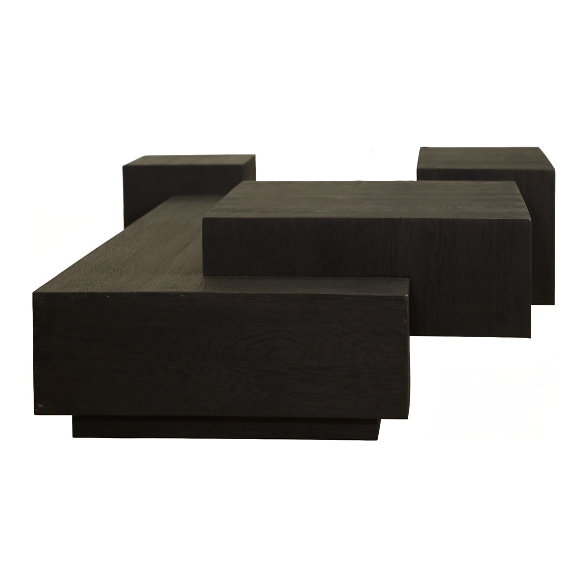 Low black oak coffee table with stacked, layered volumes