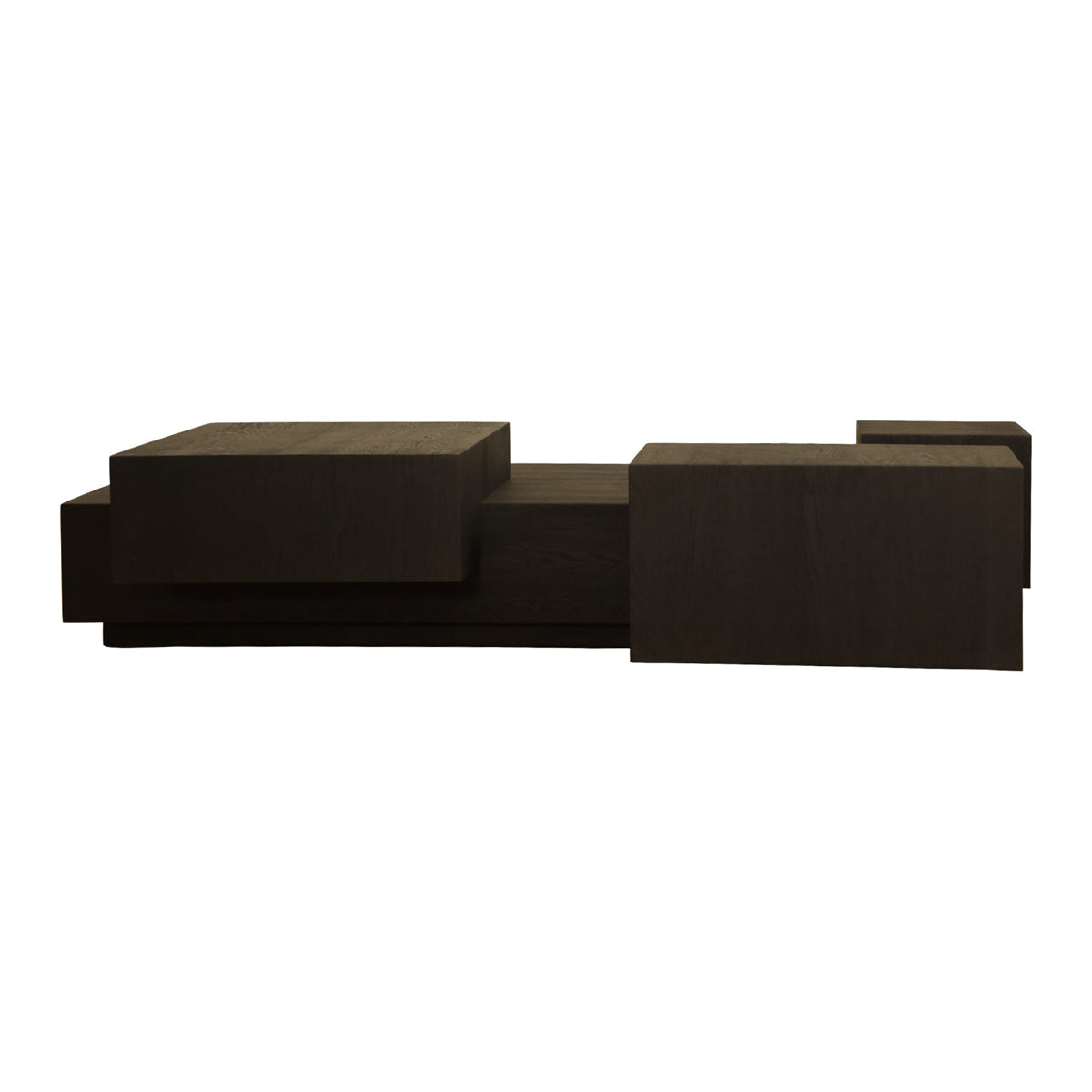 Low black oak coffee table with stacked, layered volumes