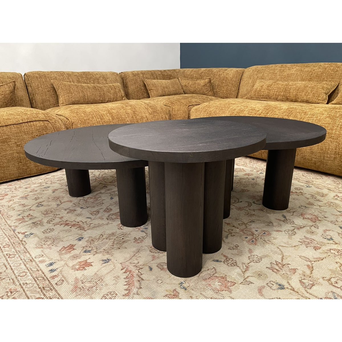 Black oak coffee table set with rounded tops and cylindrical supports