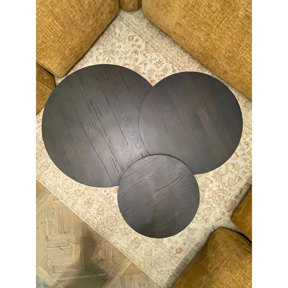 Black oak coffee table set with rounded tops and cylindrical supports