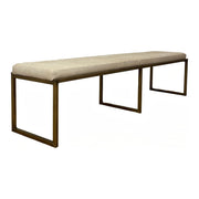 Beige upholstered bench on an open gold-toned metal frame.