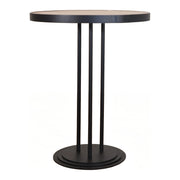 Round bistro table with honey oak top on a slender black metal base