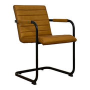 Cognac leather dining armchair with channeled seat on a steel cantilever frame