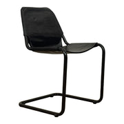Modern dining chair with a tensioned black leather seat on a steel cantilever frame