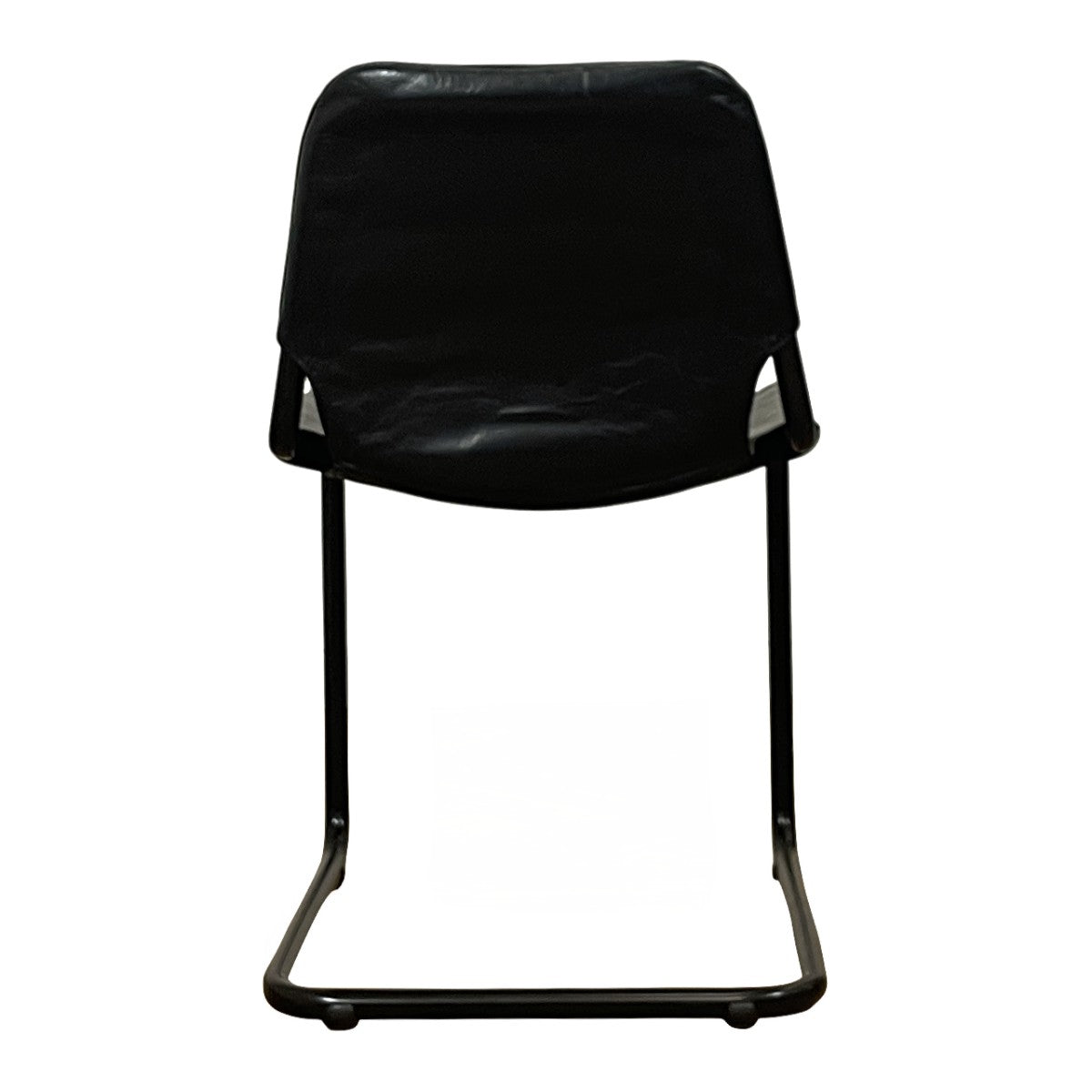 Modern dining chair with a tensioned black leather seat on a steel cantilever frame