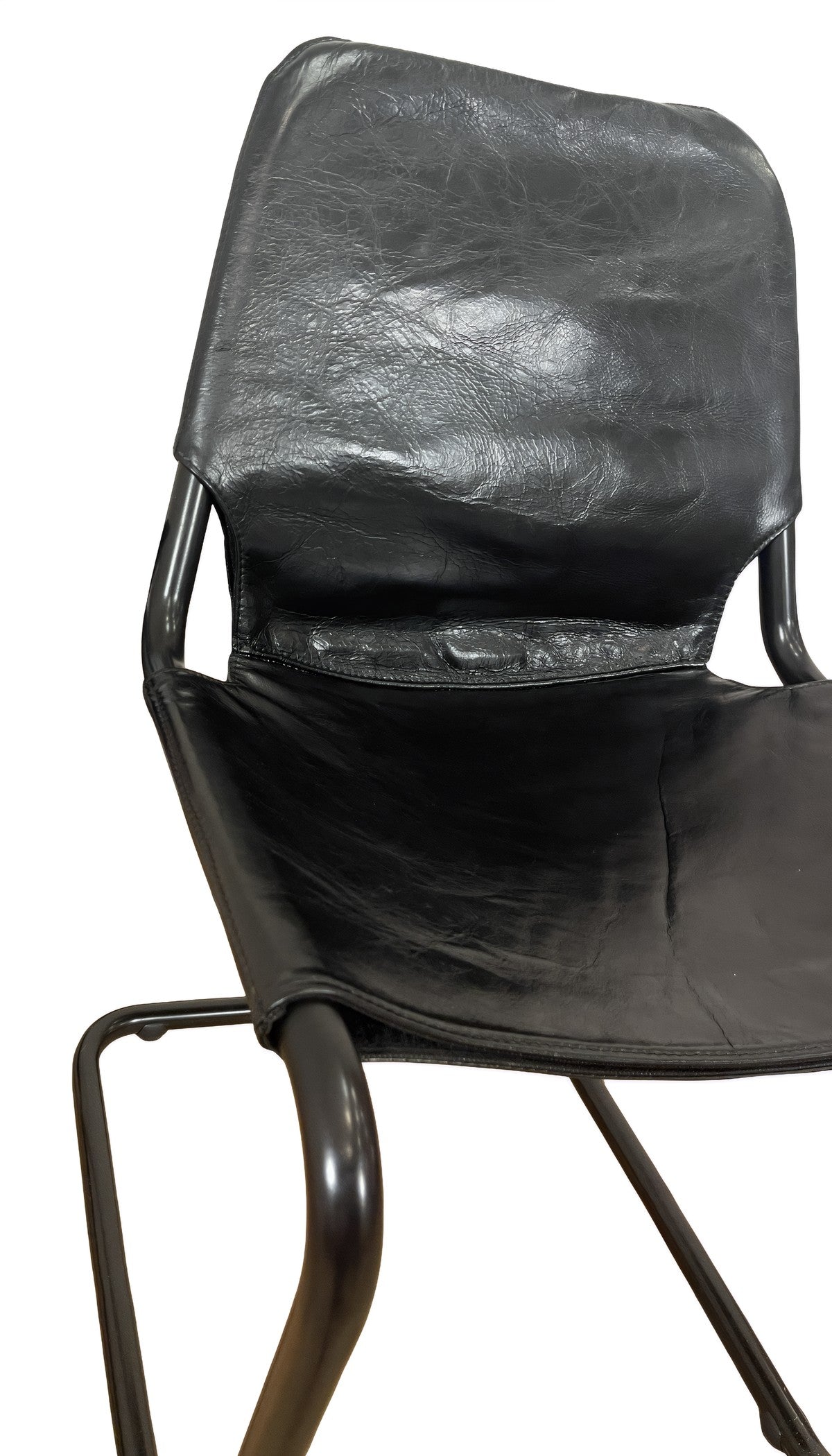 Modern dining chair with a tensioned black leather seat on a steel cantilever frame