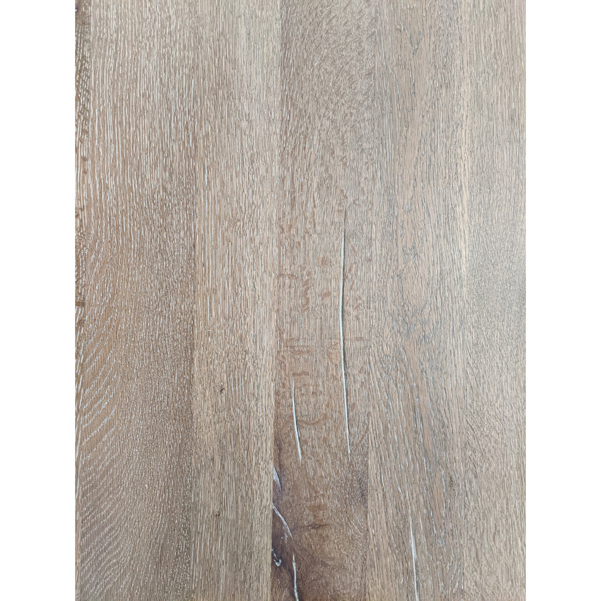 Large rustic oak dining table in grey wash on a trestle base
