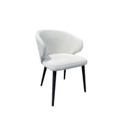 Compact dining chair in linen with a softly rounded back on a birch frame