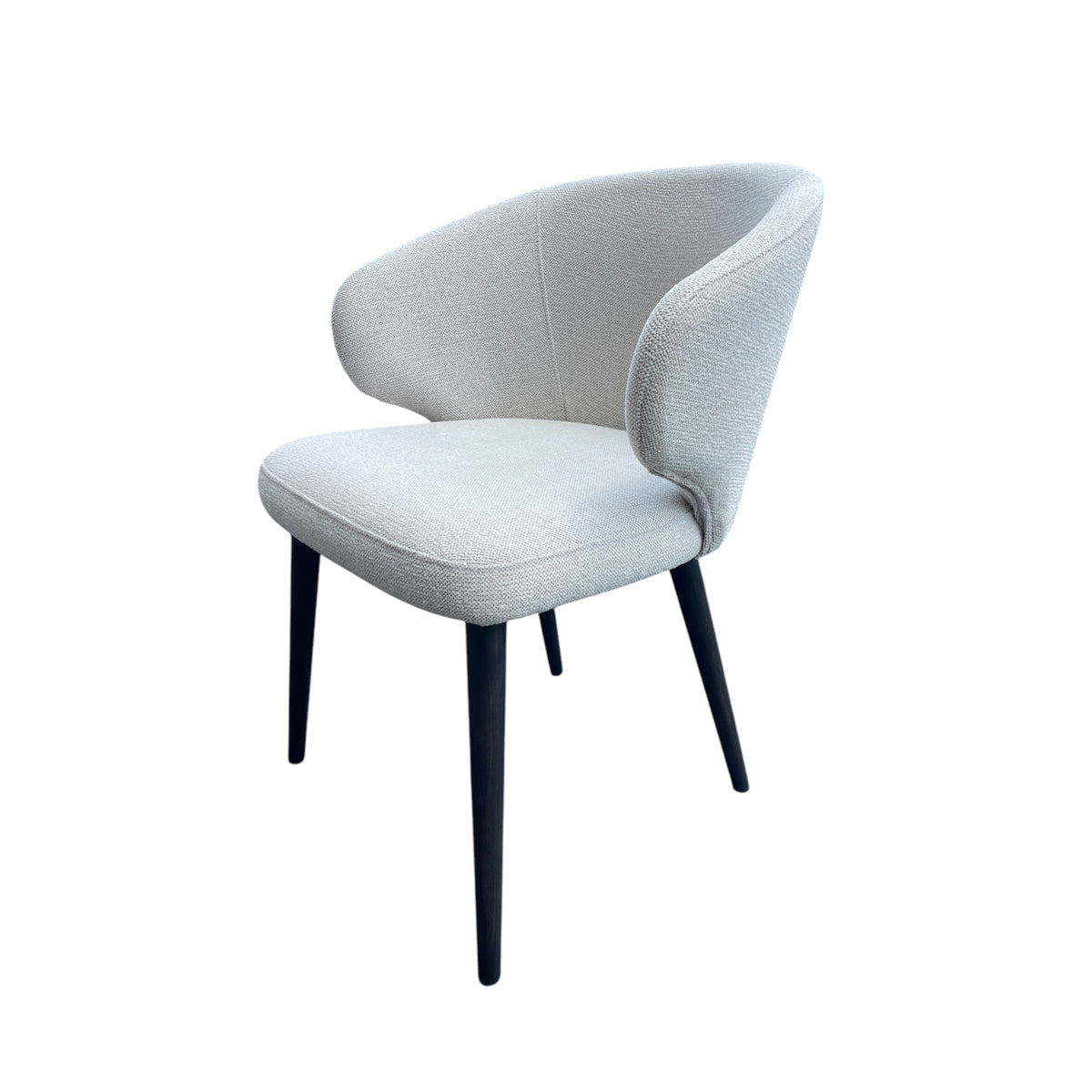 Compact dining chair in linen with a softly rounded back on a birch frame
