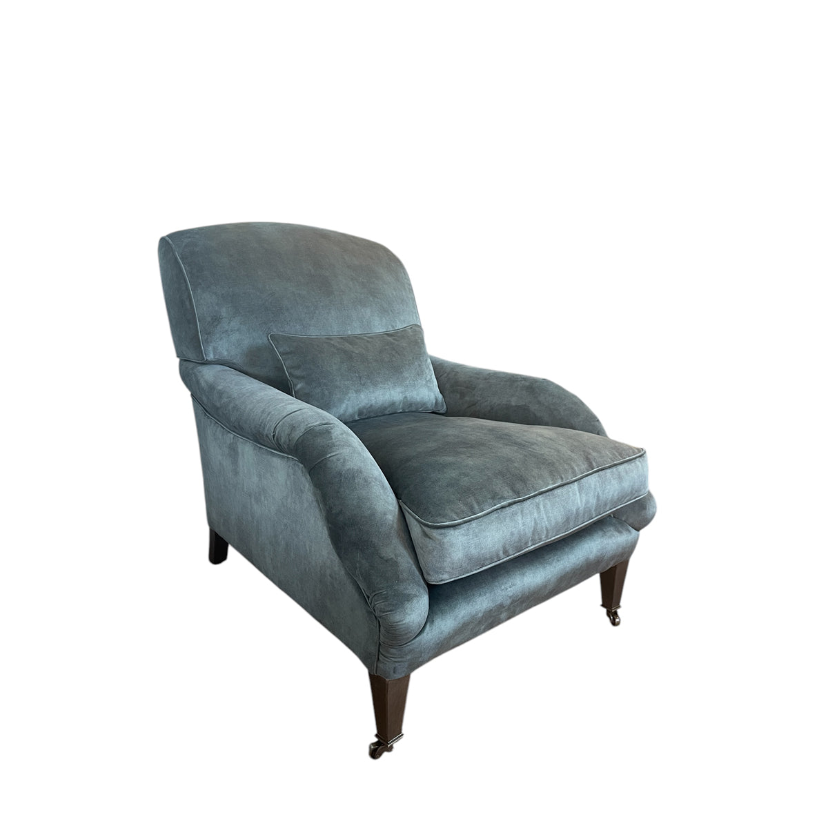 Deep lounge armchair upholstered in hunter green
