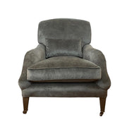 Deep lounge armchair upholstered in hunter green