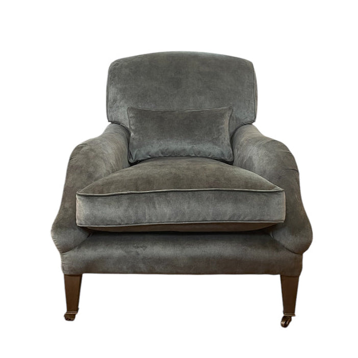 Deep lounge armchair upholstered in hunter green