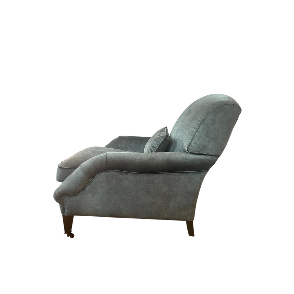 Deep lounge armchair upholstered in hunter green
