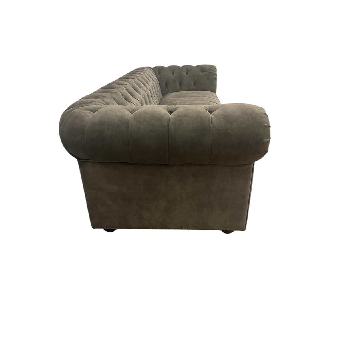 Whittington sofa in deep green Adore Hunter velvet with rolled arms and wood legs