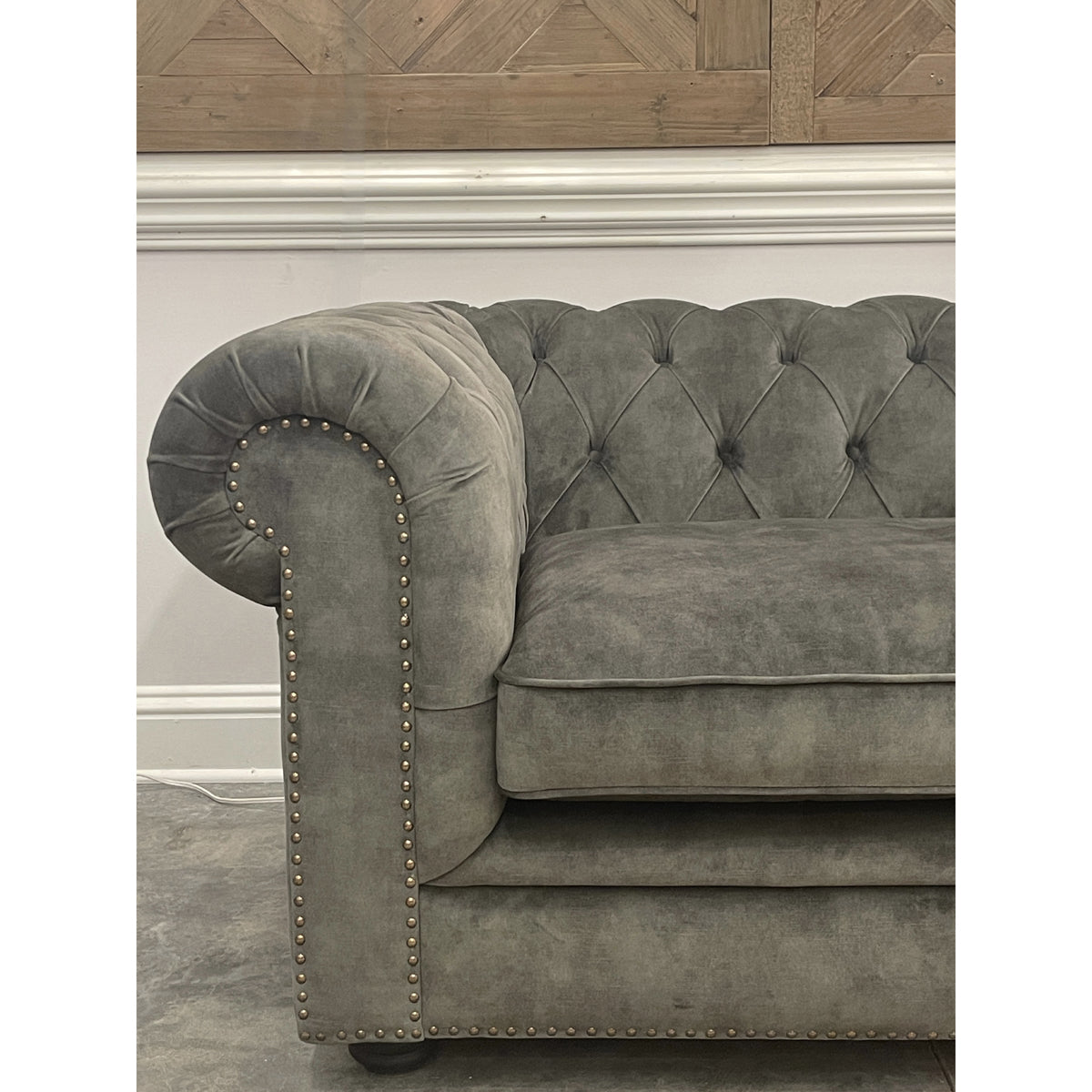 Whittington sofa in deep green Adore Hunter velvet with rolled arms and wood legs