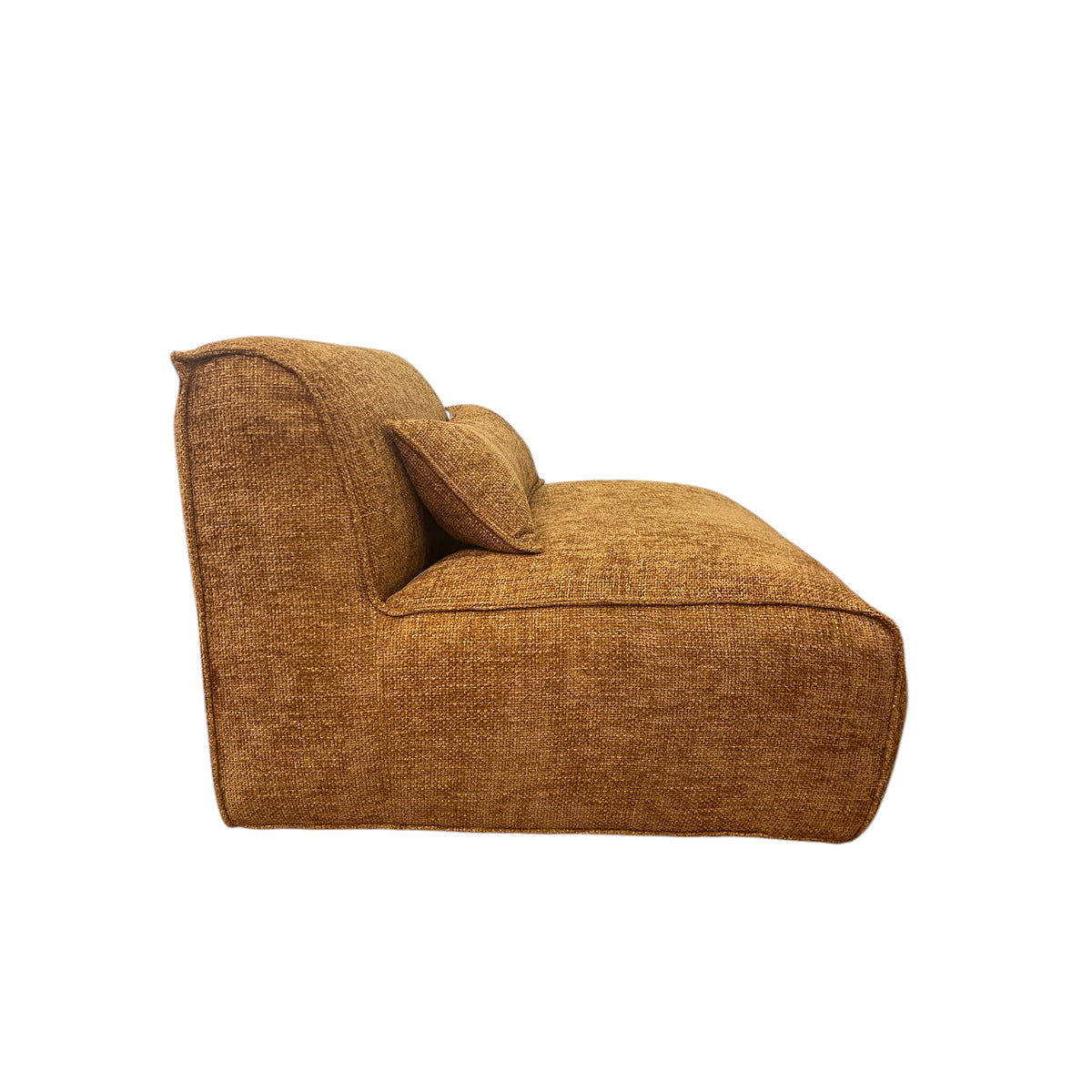Modular one-seater in mustard fabric with curved corners and a low profile