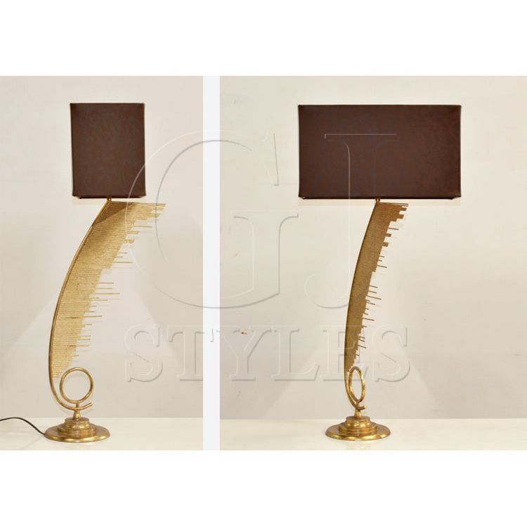 Ahab table lamp with curved asymmetric metal arm and leather shade