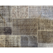 Vintage Turkish patchwork rug in soft, muted wool tones.