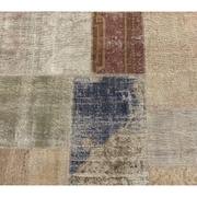 Vintage Turkish patchwork rug in a balanced rectilinear layout.