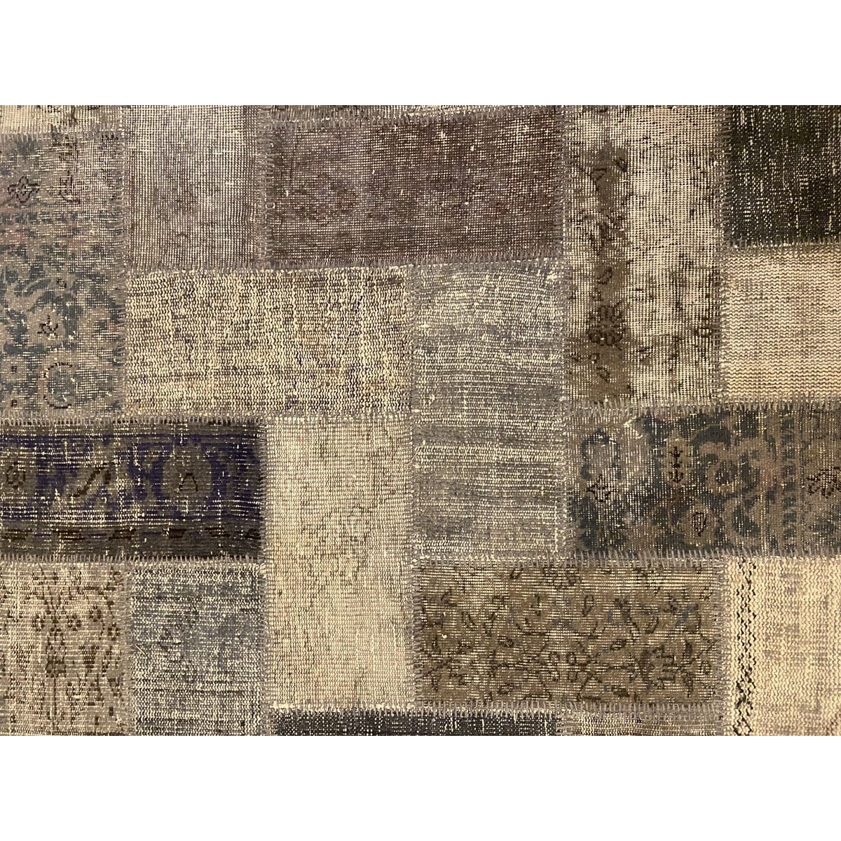 Vintage Turkish patchwork rug in a neutral wool palette.
