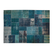 Vintage Turkish patchwork rug in turquoise wool tones.