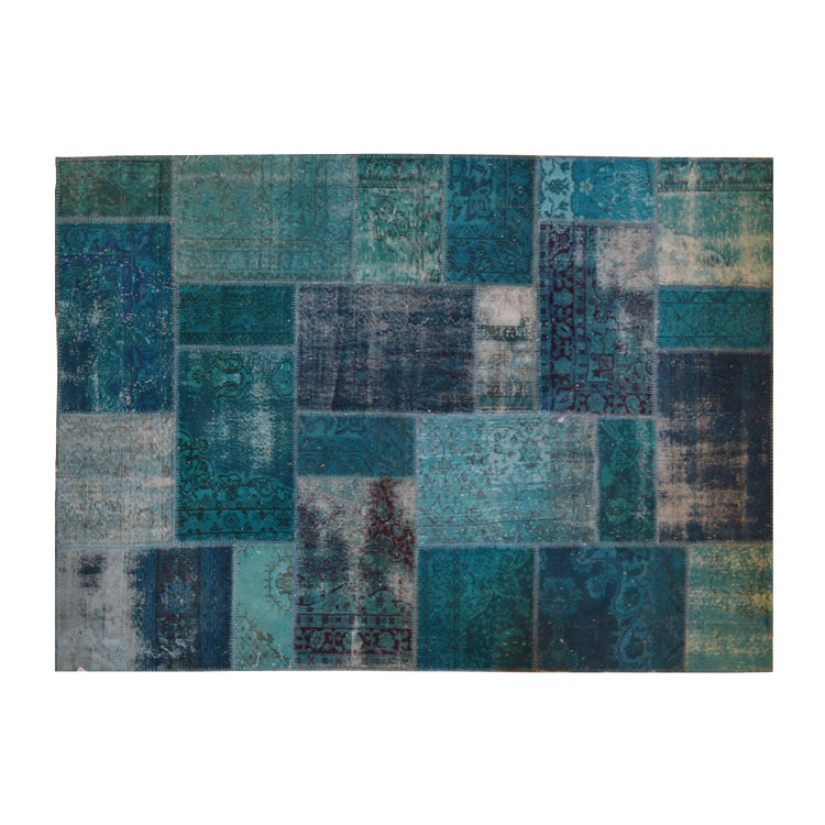 Vintage Turkish patchwork rug in turquoise wool tones.