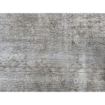 Heavily worn handwoven Turkish wool rug in cool, faded tones.